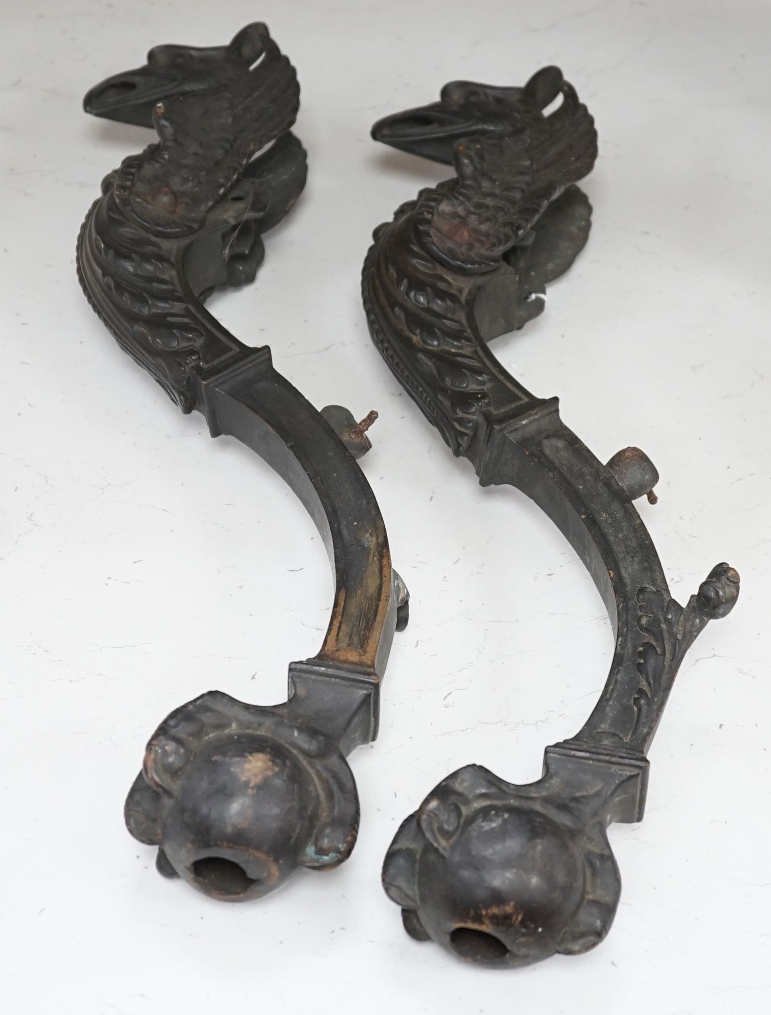 A pair of 19th century bronze griffin furniture mounts 62cm